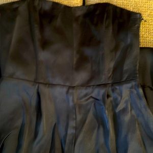 Black satin jumpsuit.